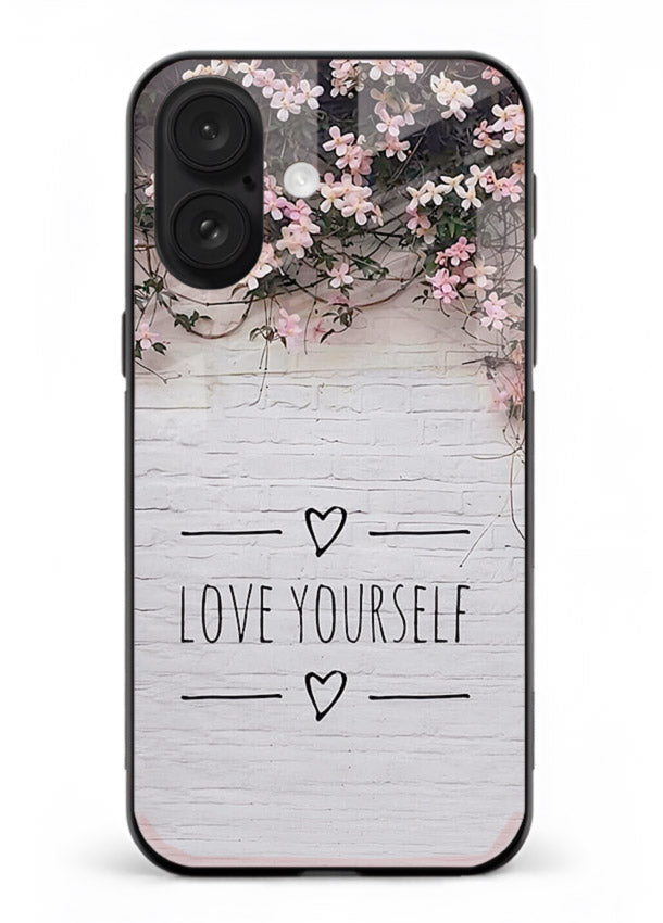 Floral self-love message printed on iphone 16 glass back cover with gentle pastel tones.