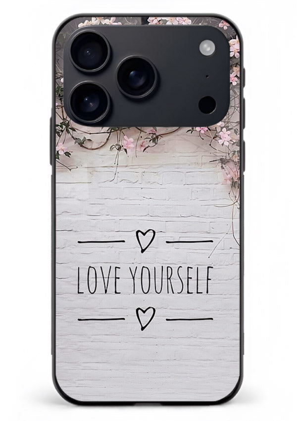 Floral self-love message printed on iphone 17 pro max glass back cover with gentle pastel tones.