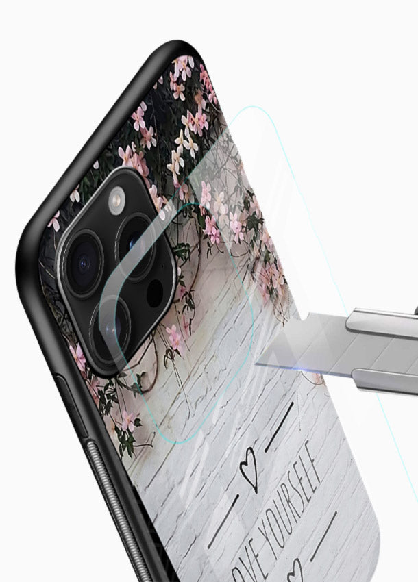 Floral self-love message printed on glossy vibrant premium glass back cover with gentle pastel tones. - Angle Blade