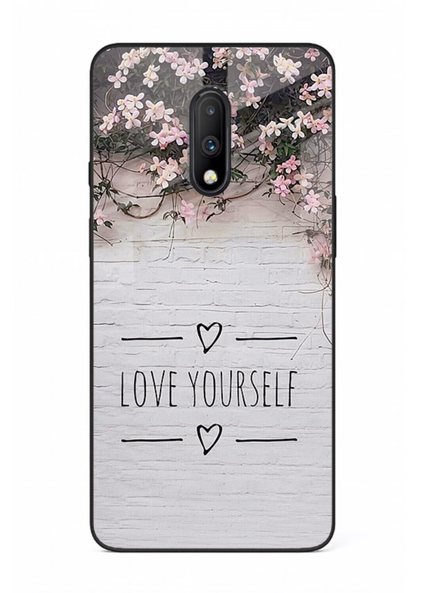 Floral self-love message printed on OnePlus 7 glass back cover with gentle pastel tones.