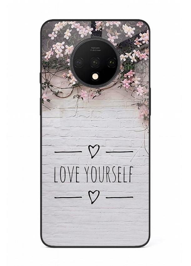 Floral self-love message printed on OnePlus 7T glass back cover with gentle pastel tones.