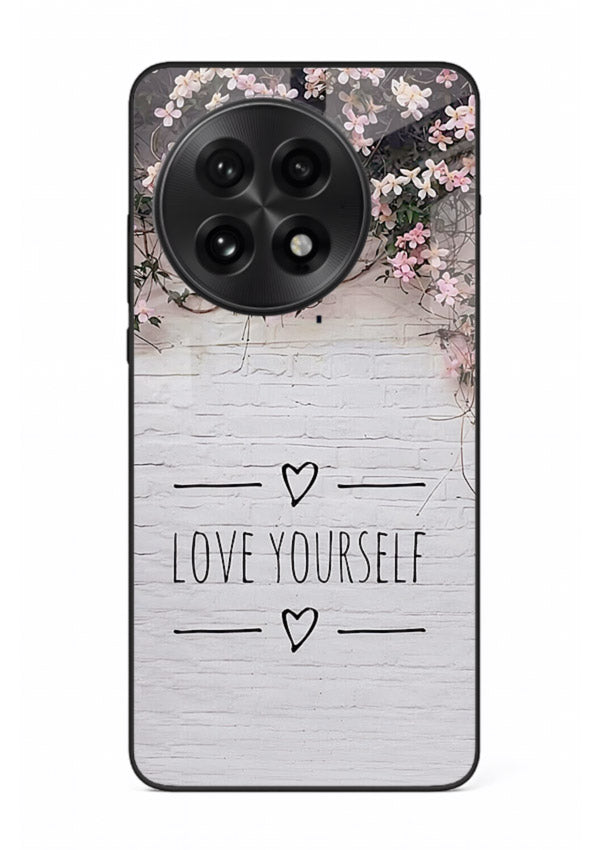 Floral self-love message printed on OnePlus 13 glass back cover with gentle pastel tones.