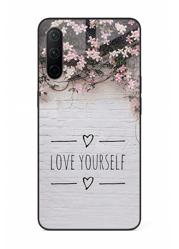 Floral self-love message printed on OnePlus Nord CE 5G glass back cover with gentle pastel tones.