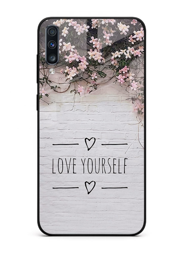 Floral self-love message printed on Samsung A70 glass back cover with gentle pastel tones.
