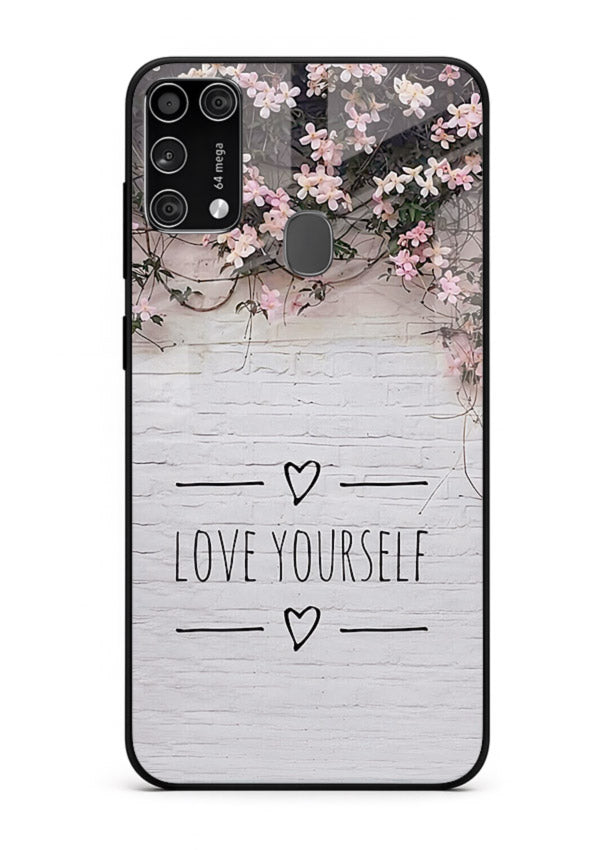 Floral self-love message printed on Samsung M31 Prime glass back cover with gentle pastel tones.