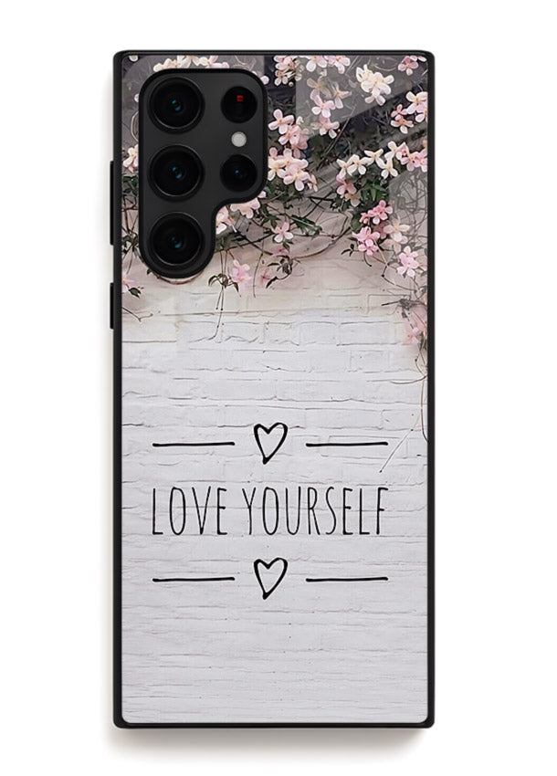 Floral self-love message printed on Samsung S24 Ultra glass back cover with gentle pastel tones.