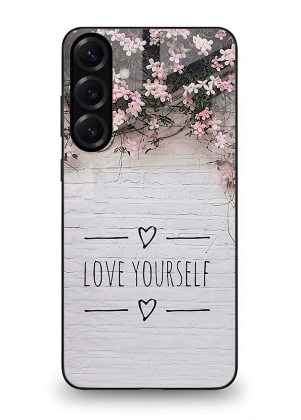Floral self-love message printed on Samsung M34 5G glass back cover with gentle pastel tones.
