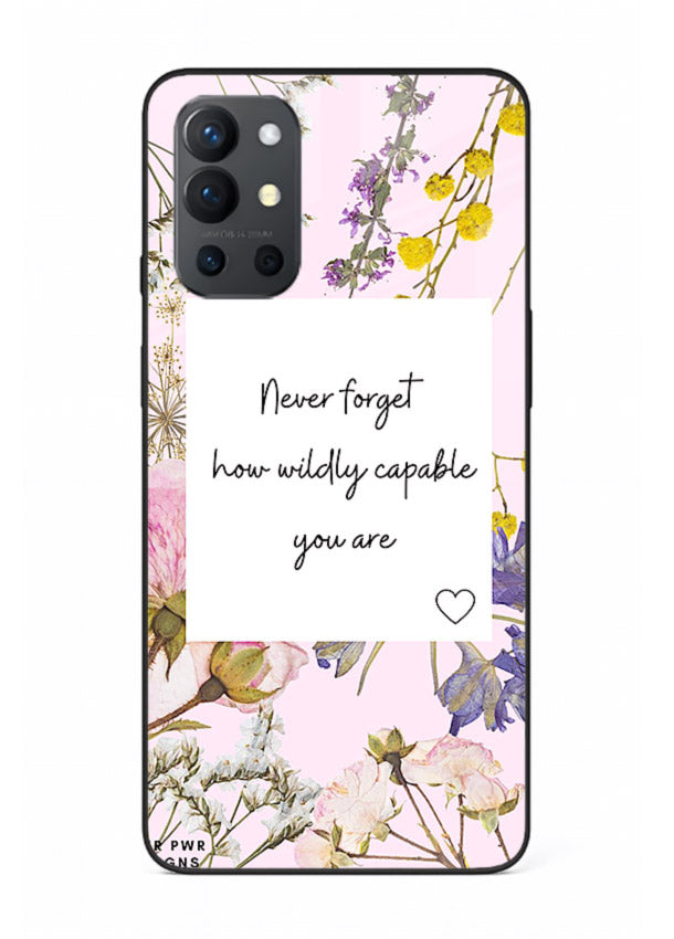 Floral-bordered motivational message printed on OnePlus 9R glass back cover with soft tones.