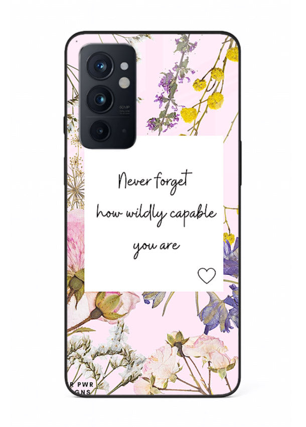 Floral-bordered motivational message printed on OnePlus 9RT glass back cover with soft tones.