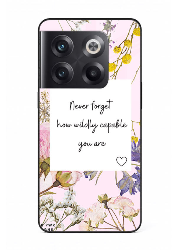 Floral-bordered motivational message printed on OnePlus 10T glass back cover with soft tones.