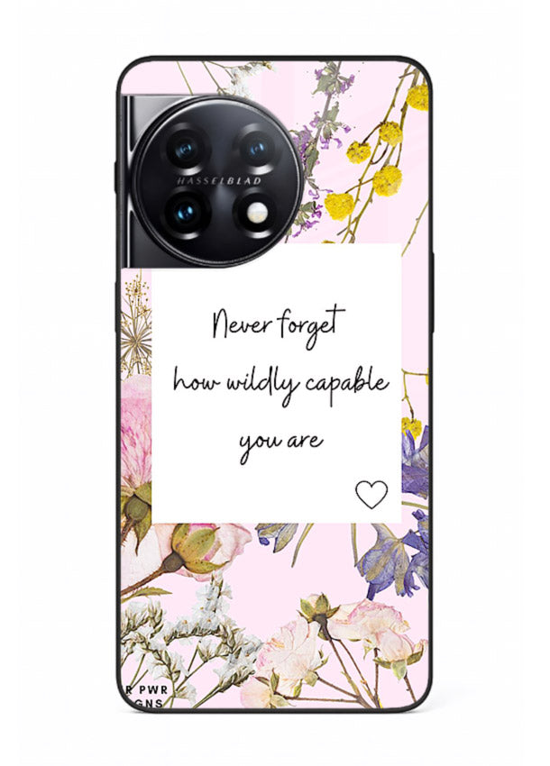 Floral-bordered motivational message printed on OnePlus 11 glass back cover with soft tones.