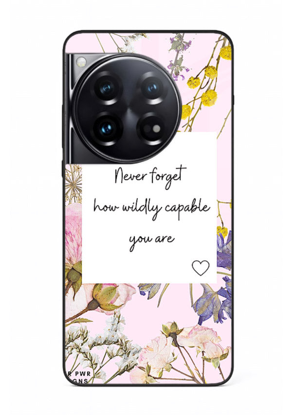 Floral-bordered motivational message printed on OnePlus 12 glass back cover with soft tones.