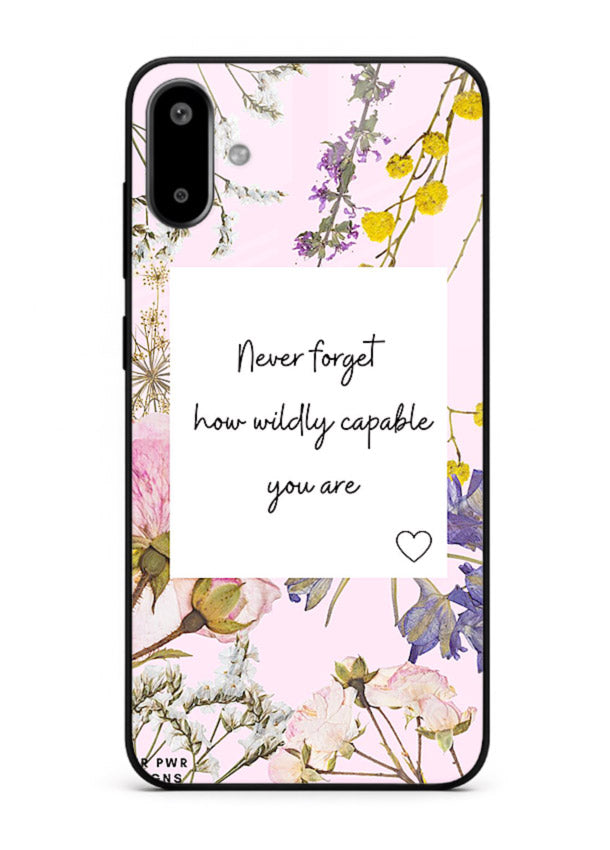 Floral-bordered motivational message printed on Samsung F06 5G glass back cover with soft tones.