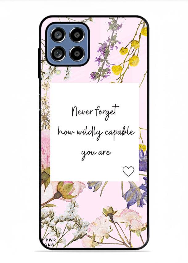 Floral-bordered motivational message printed on Samsung F12 5G glass back cover with soft tones.
