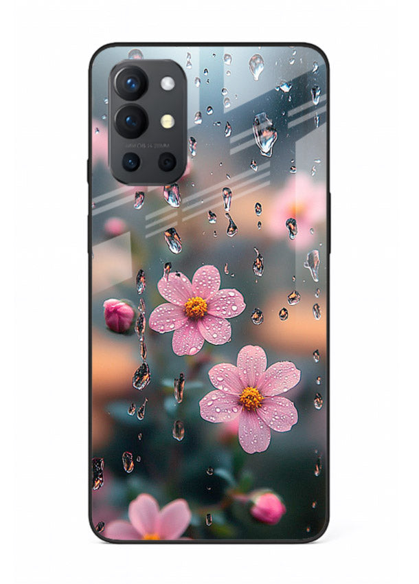 Raindrop cherry blossom artwork on OnePlus 9R glass back cover with soft pastel tones.