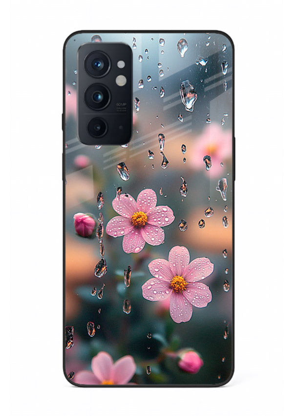 Raindrop cherry blossom artwork on OnePlus 9RT glass back cover with soft pastel tones.