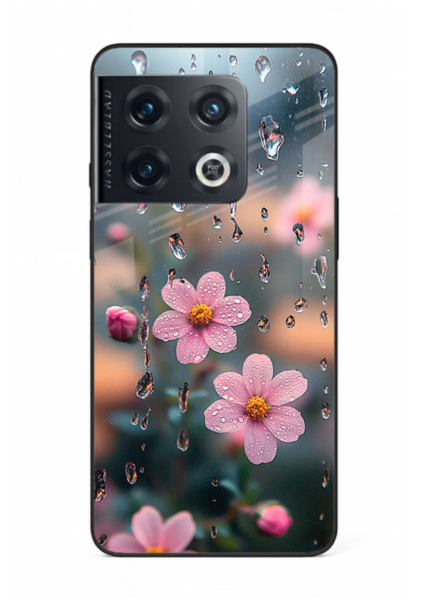 Raindrop cherry blossom artwork on OnePlus 10 Pro glass back cover with soft pastel tones.