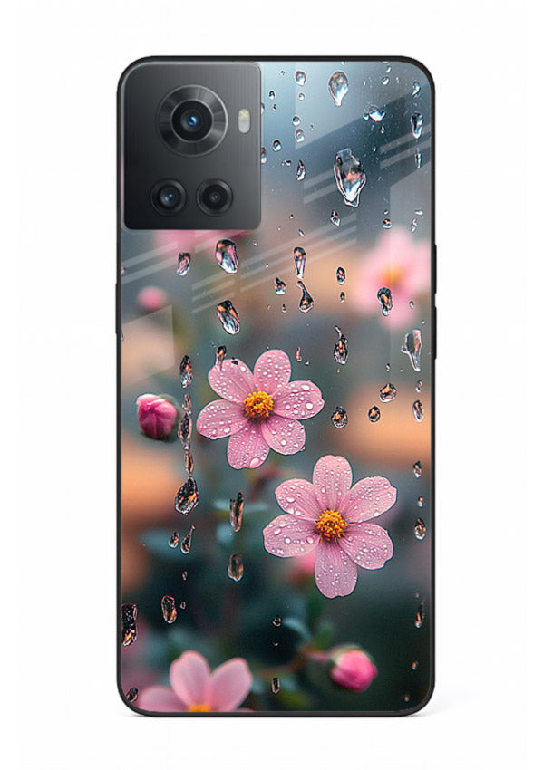Raindrop cherry blossom artwork on OnePlus 10R glass back cover with soft pastel tones.
