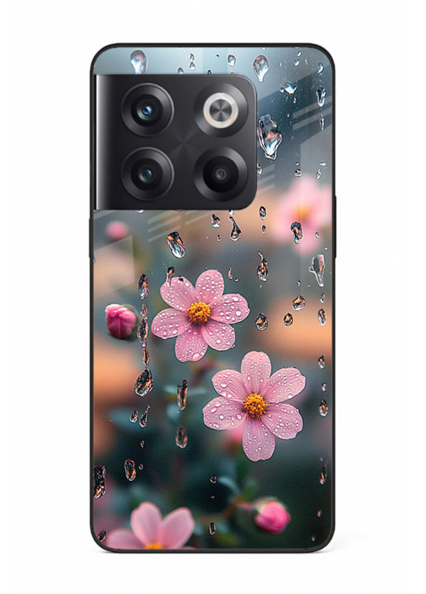 Raindrop cherry blossom artwork on OnePlus 10T glass back cover with soft pastel tones.