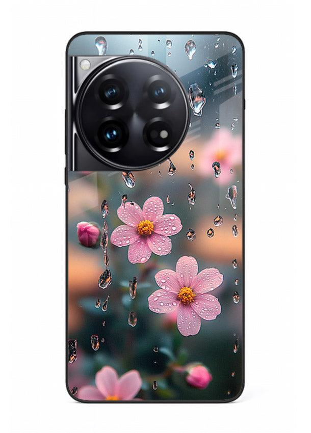 Raindrop cherry blossom artwork on OnePlus 12 glass back cover with soft pastel tones.