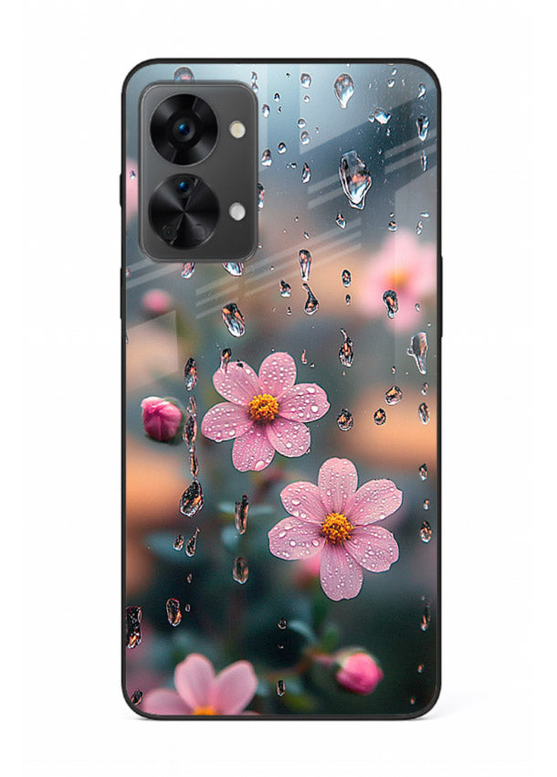 Raindrop cherry blossom artwork on OnePlus Nord 2T glass back cover with soft pastel tones.