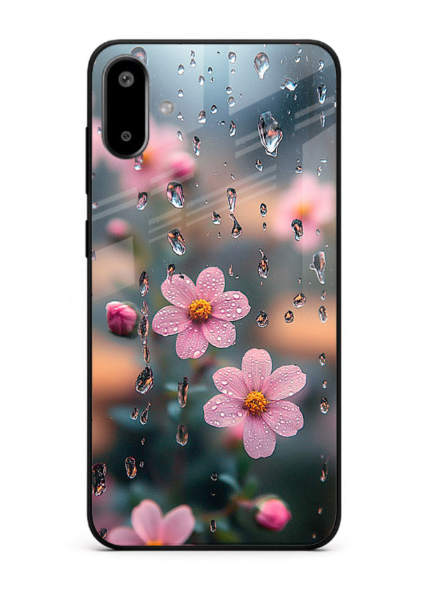 Raindrop cherry blossom artwork on Samsung F06 5G glass back cover with soft pastel tones.