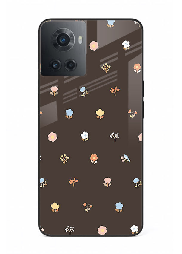 Pastel tiny flower pattern on OnePlus 10R glass back cover with playful botanical spacing.