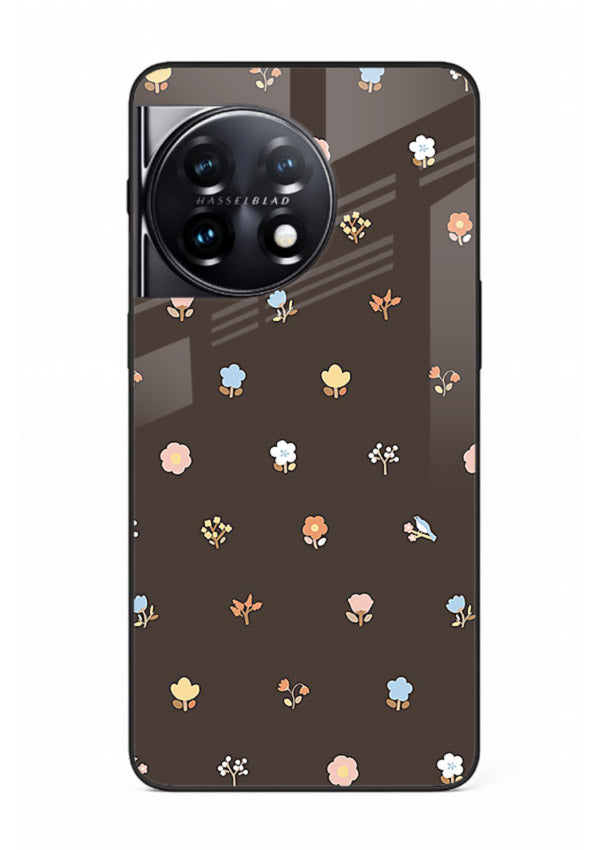 Pastel tiny flower pattern on OnePlus 11 glass back cover with playful botanical spacing.