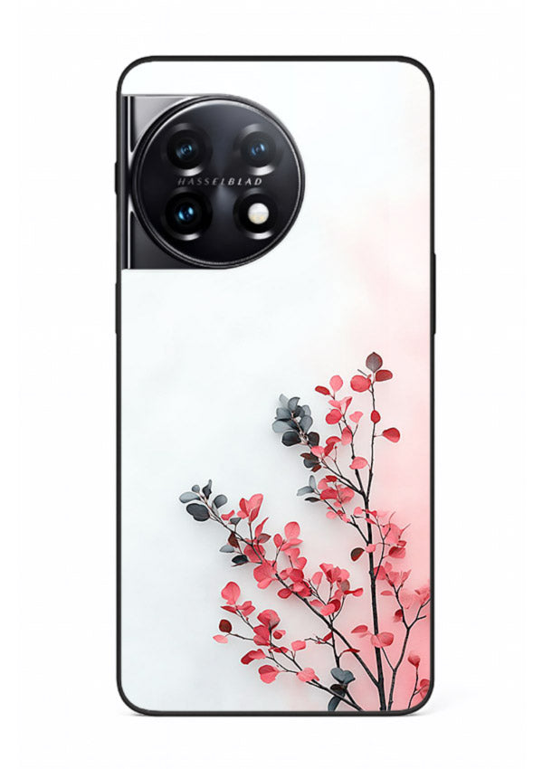 Red leaf artwork on OnePlus 11 glass back cover with warm drifting botanical tones.