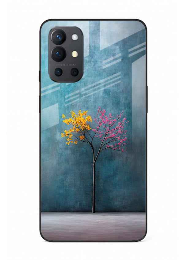 Blue tree artwork on OnePlus 9R glass back cover with soft minimal artistic tones.