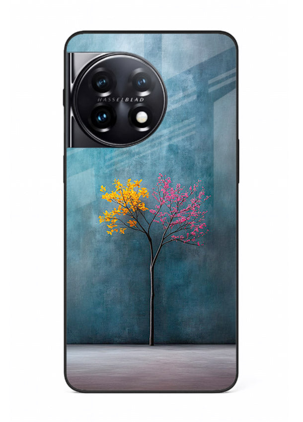 Blue tree artwork on OnePlus 11R glass back cover with soft minimal artistic tones.