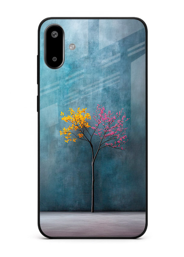 Blue tree artwork on Samsung F06 5G glass back cover with soft minimal artistic tones.