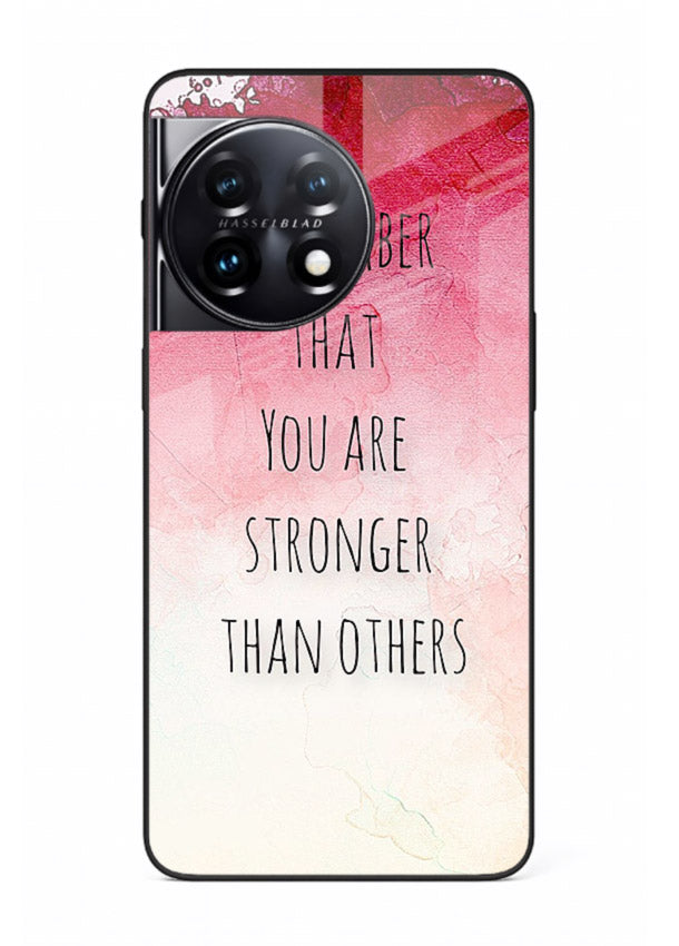 Watercolor determination quote printed on OnePlus 11 glass back cover with gentle tones.