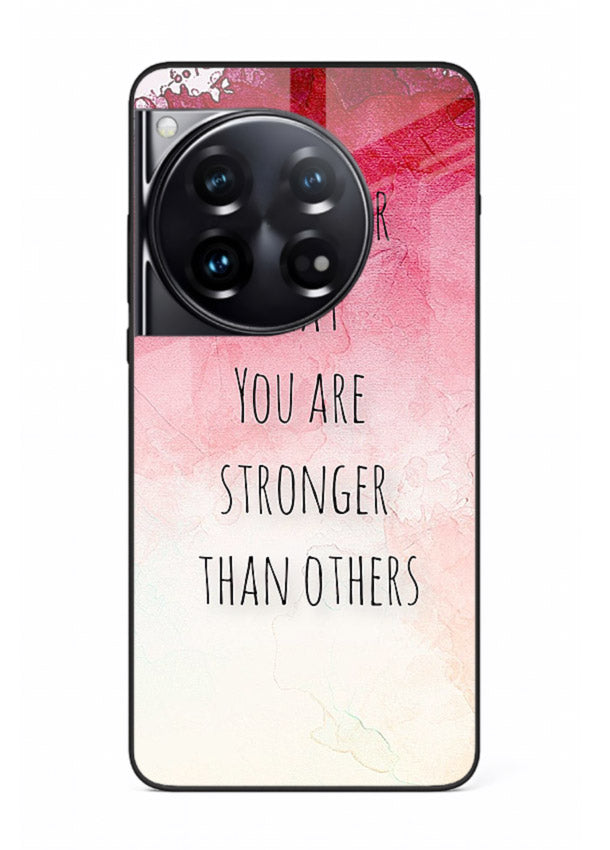 Watercolor determination quote printed on OnePlus 12 glass back cover with gentle tones.