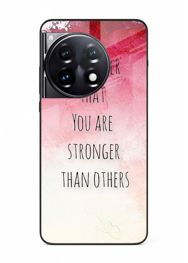 Watercolor determination quote printed on OnePlus 12R glass back cover with gentle tones.