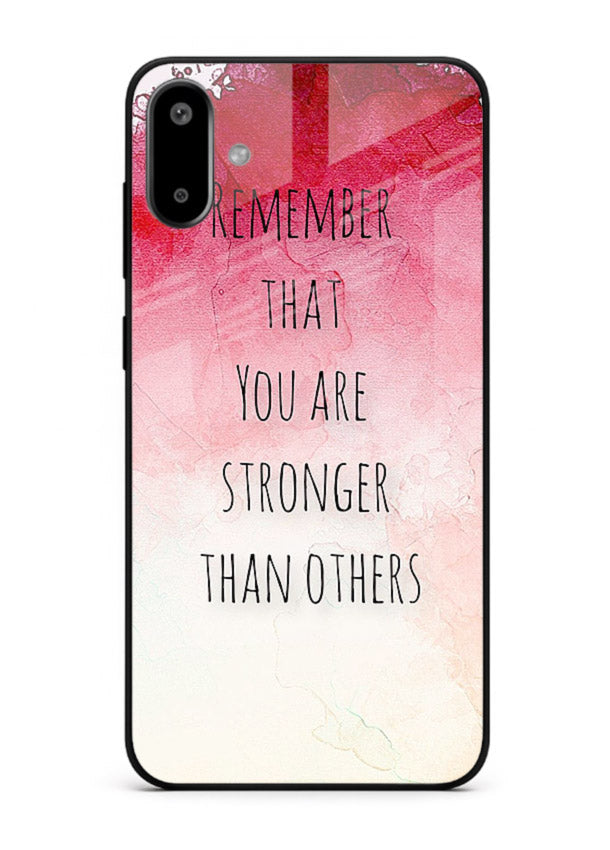 Watercolor determination quote printed on Samsung F06 5G glass back cover with gentle tones.