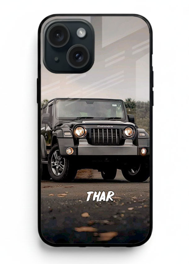 Mahindra Thar SUV in outdoor terrain with rugged off-road styling for iPhone 15 Plus
