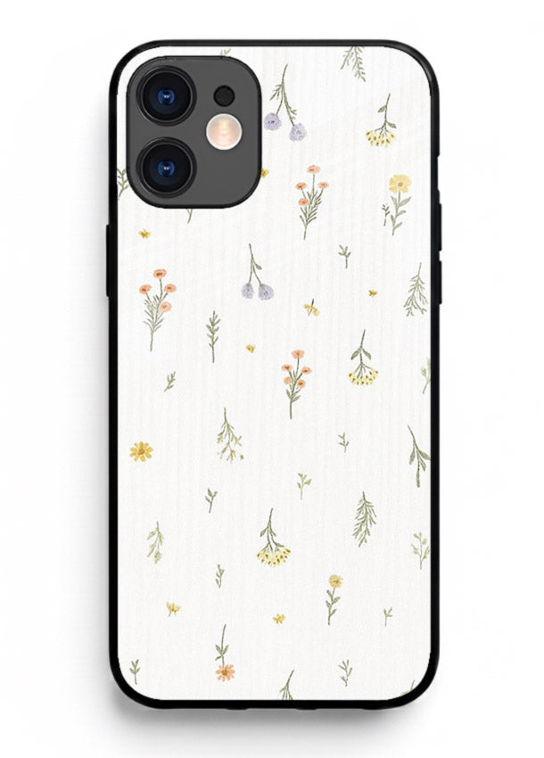 Tiny floral pattern artwork on iphone 12 mini glass back cover with scattered blooms.