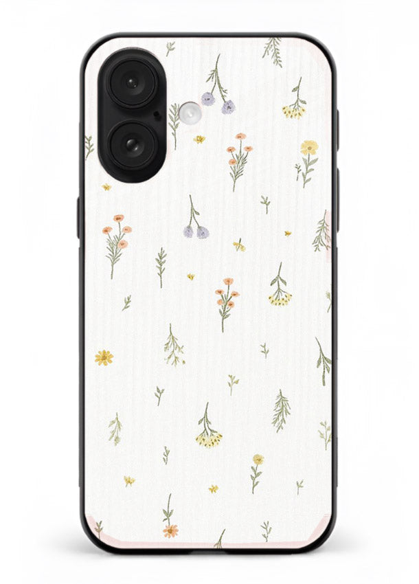 Tiny floral pattern artwork on iphone 18 glass back cover with scattered blooms.