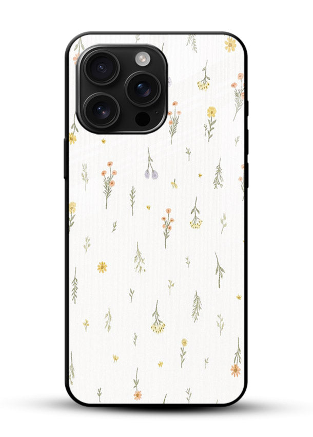 Tiny floral pattern artwork on glossy vibrant premium glass back cover with scattered blooms. - Angle Front