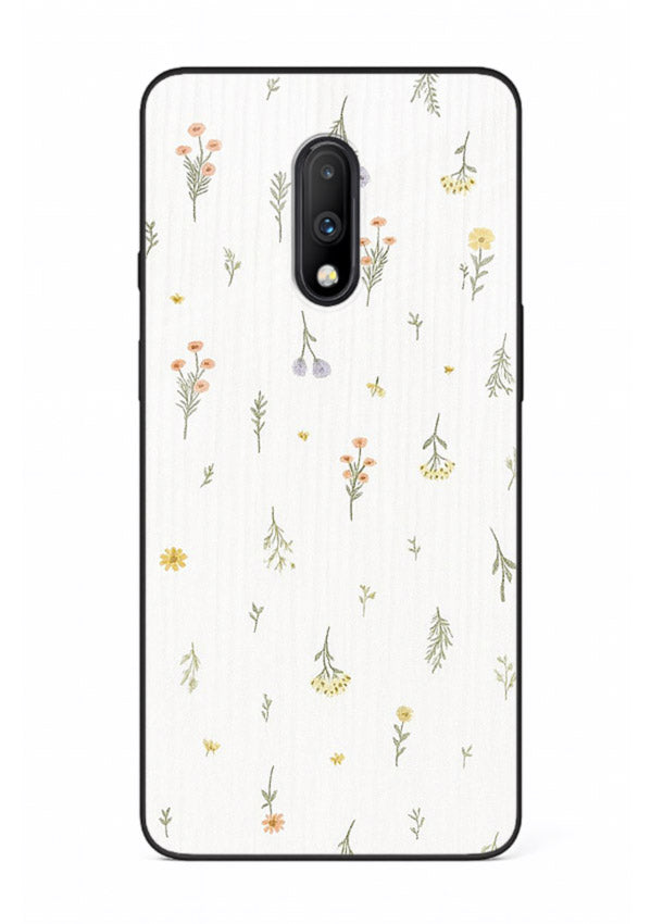 Tiny floral pattern artwork on OnePlus 7 glass back cover with scattered blooms.