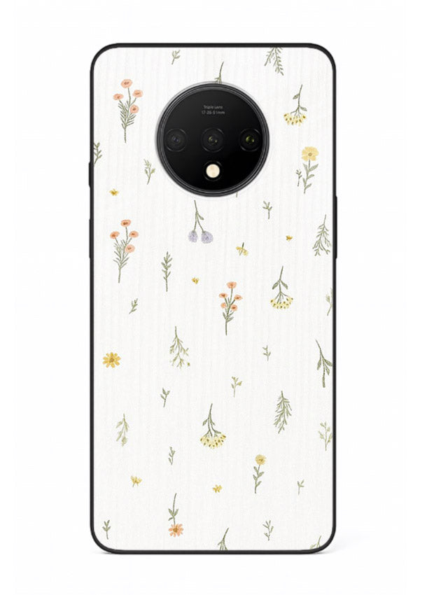 Tiny floral pattern artwork on OnePlus 7T glass back cover with scattered blooms.
