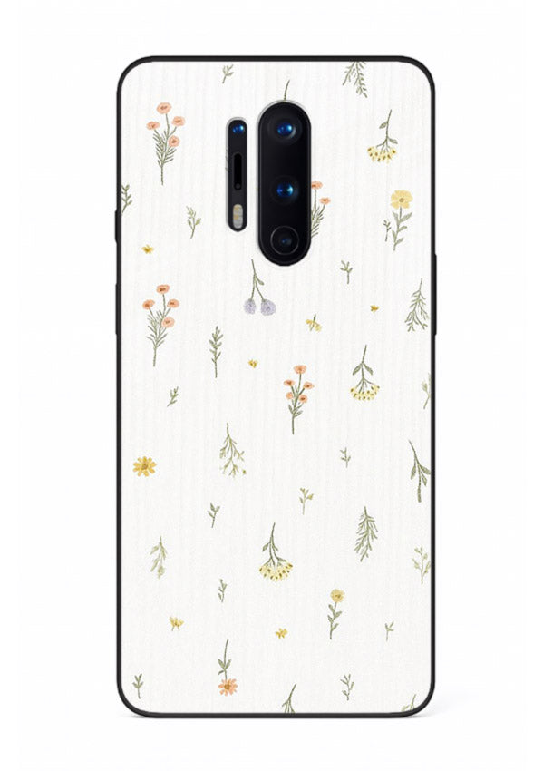 Tiny floral pattern artwork on OnePlus 8 Pro glass back cover with scattered blooms.