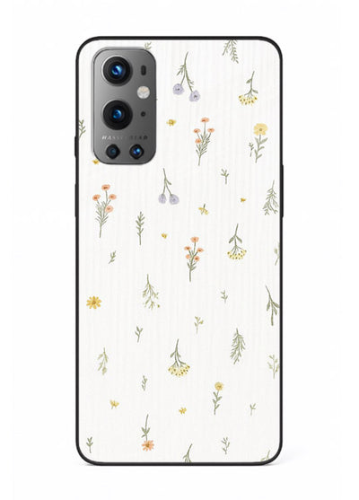 Tiny floral pattern artwork on OnePlus 9 glass back cover with scattered blooms.