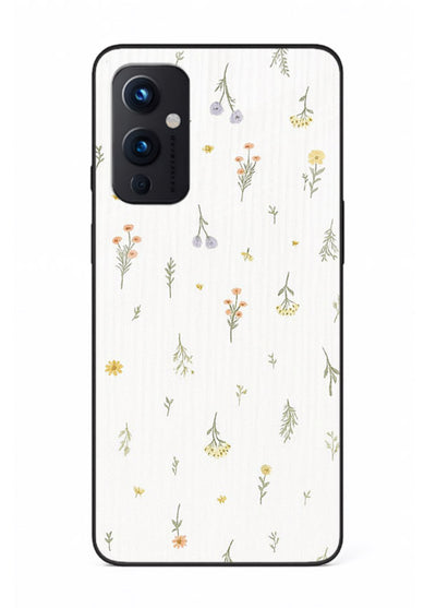 Tiny floral pattern artwork on OnePlus 9 Pro glass back cover with scattered blooms.