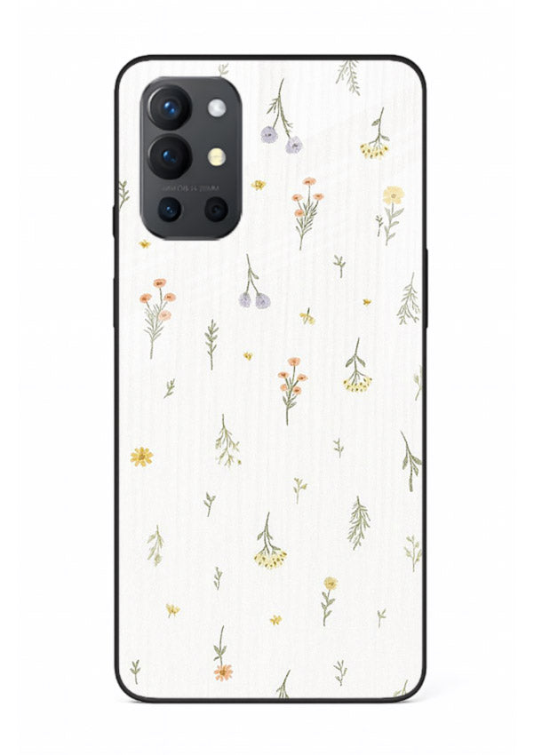 Tiny floral pattern artwork on OnePlus 9R glass back cover with scattered blooms.