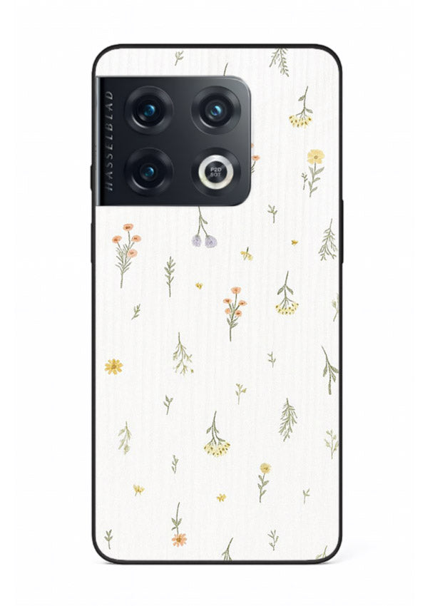 Tiny floral pattern artwork on OnePlus 10 Pro glass back cover with scattered blooms.