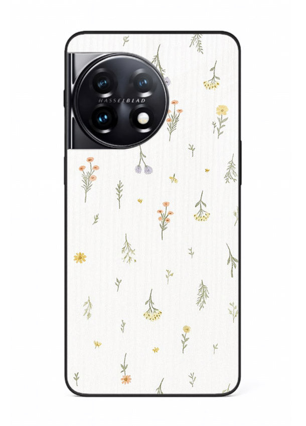 Tiny floral pattern artwork on OnePlus 11 glass back cover with scattered blooms.