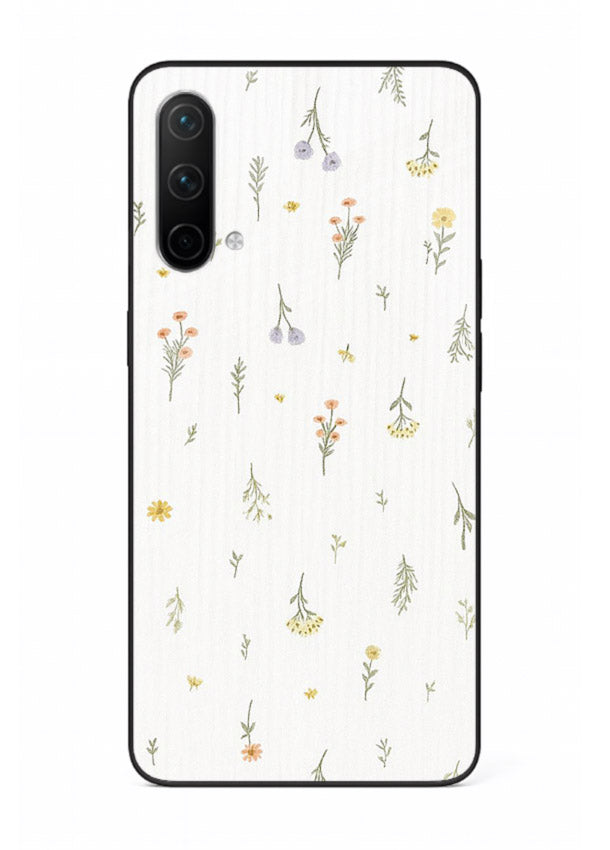 Tiny floral pattern artwork on OnePlus Nord CE 5G glass back cover with scattered blooms.