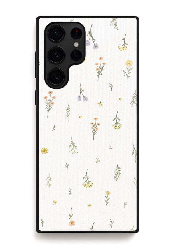 Tiny floral pattern artwork on Samsung S25 Ultra glass back cover with scattered blooms.